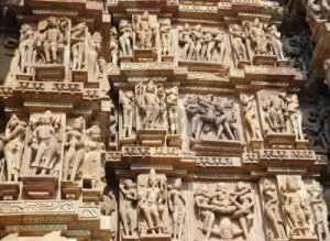 5671544-famous-kamasutra-scenes-on-the-wall-of-hindu-temple-in-khajuraho-india